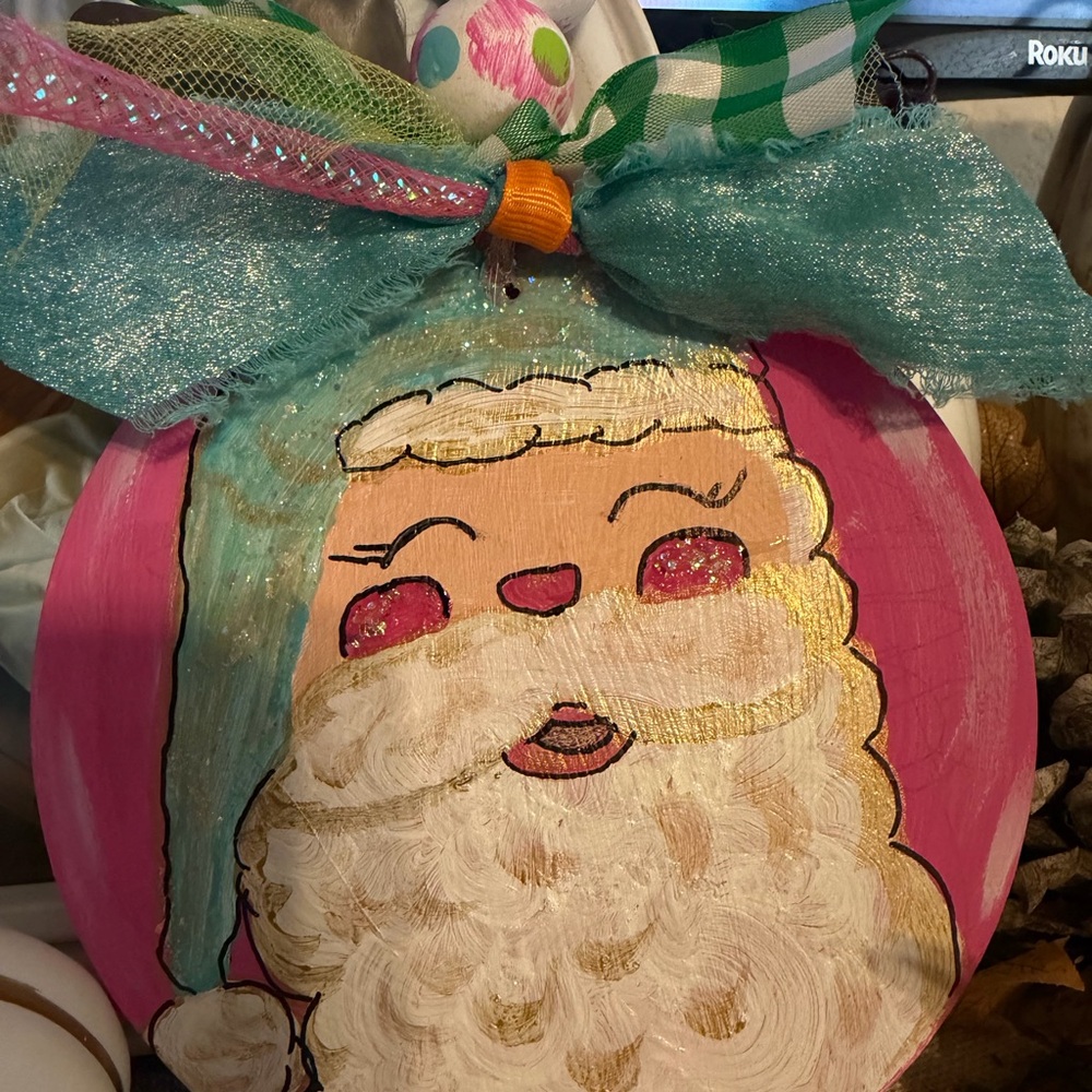 Hand painted Festive Santa Ornament with glitter Accents-Ribbon Colors may vary.